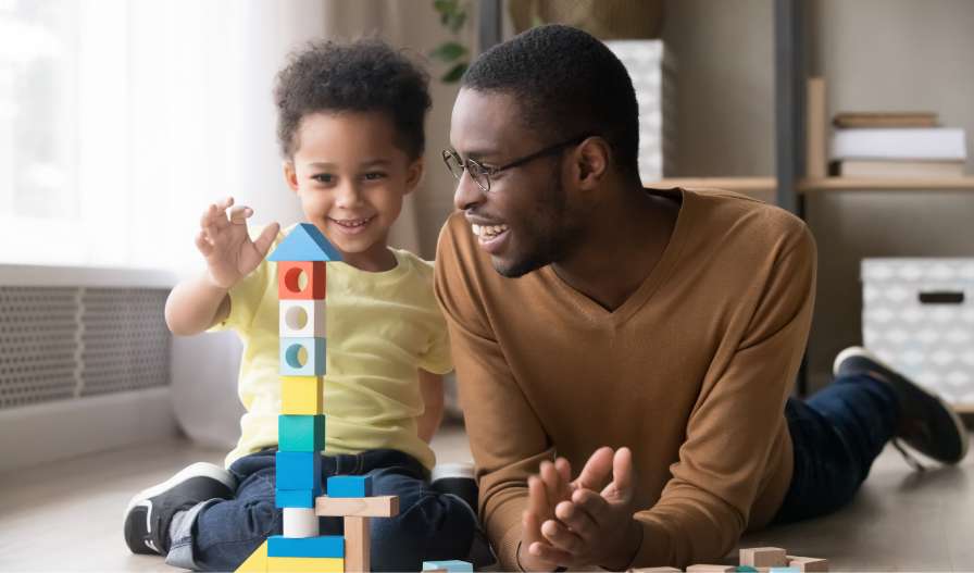 father playing with his toddler son